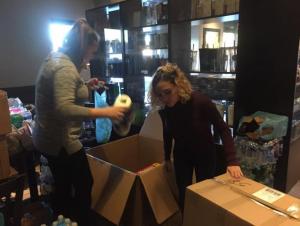 students packing boxes