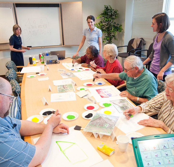 Senior citizens sitting at a large table