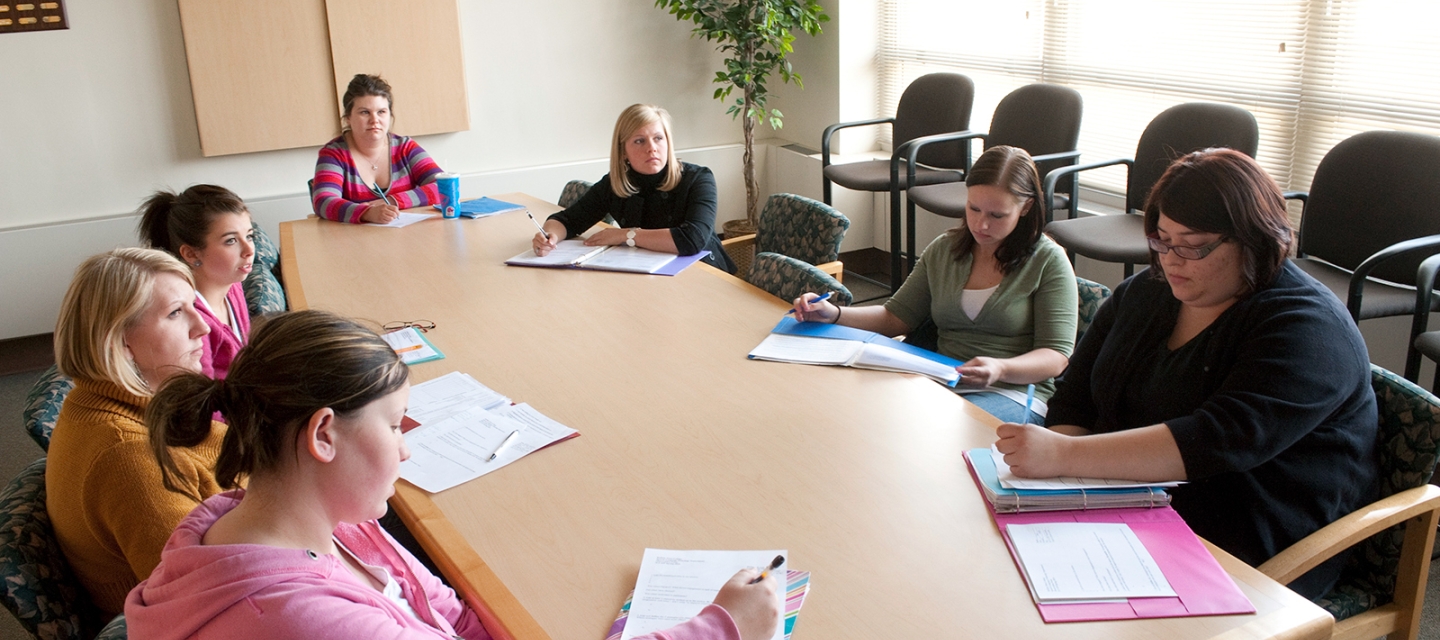 Class sitting around a large table